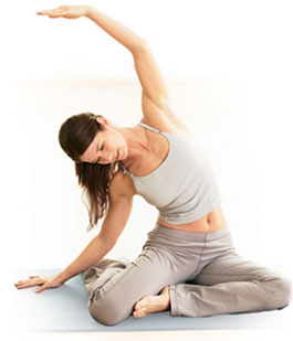 Pilates instructor demonstrating proper form and technique